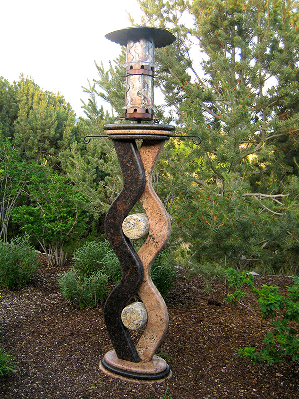 "Sanctuary 2009 Bird Feeder Pedestal, three granites/copper feeder. 6' tall Commissioned installation"